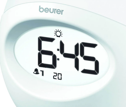 Reloj Despertador con luz de varios colores, cuenta con radio y conexión USB para reproducir música desde el celular Marca Beurer